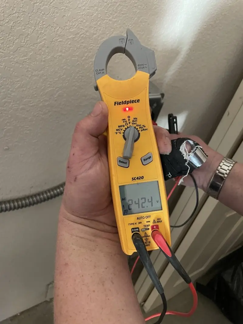 Voltage testing with clamp meter during Electrical Installation Services in Olean